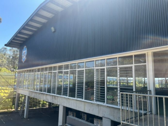 A Large Building With a Lot of Windows and a Balcony — Architectural Glass Solutions QLD in Cooroy, QLD