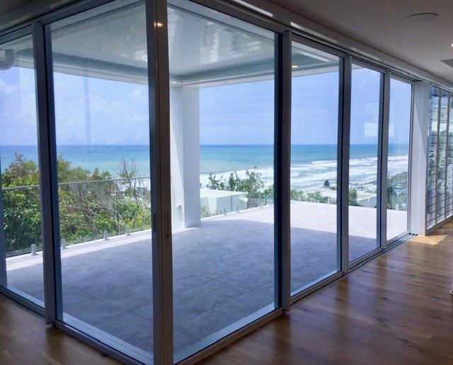 Panoramic View of Ocean Through Large Glass Windows — Architectural Glass Solutions QLD in Cooroy, QLD