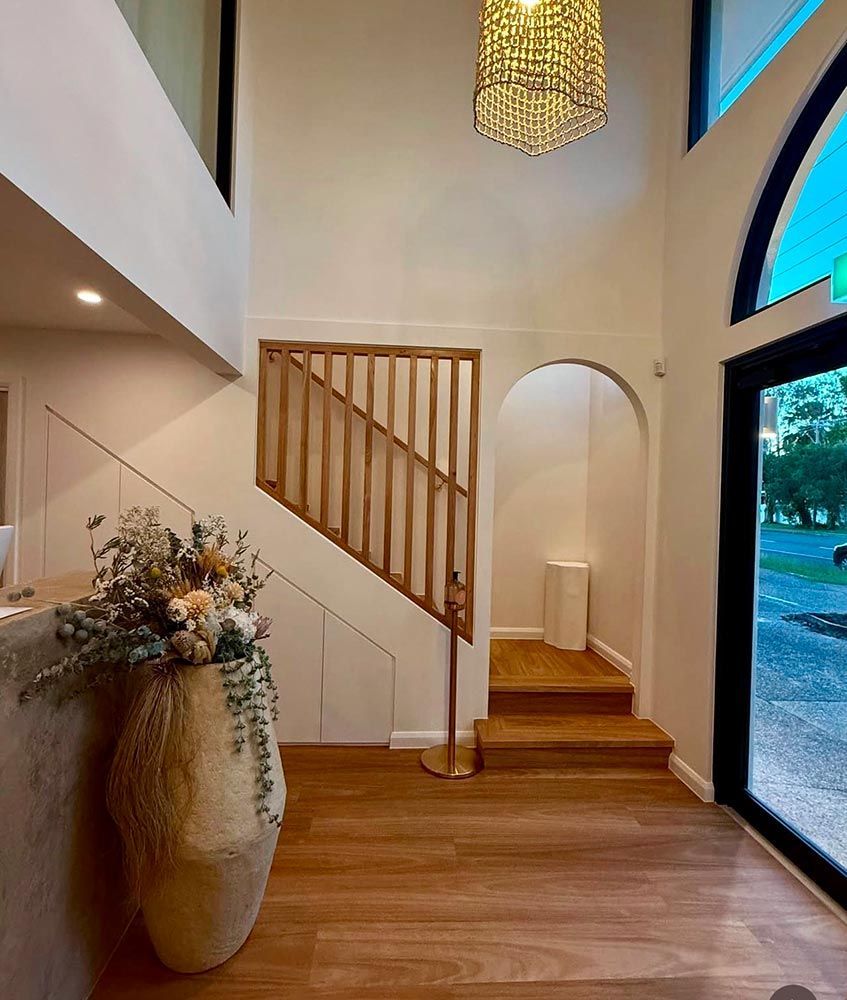 Interior With a Staircase, Wooden Floors, and an Arched Doorway — Architectural Glass Solutions QLD in Cooroy, QLD