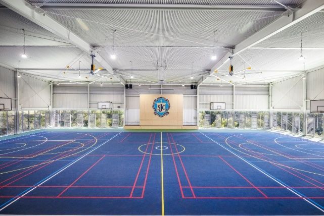 Indoor Basketball Court With a Logo on the Wall — Architectural Glass Solutions QLD in Cooroy, QLD