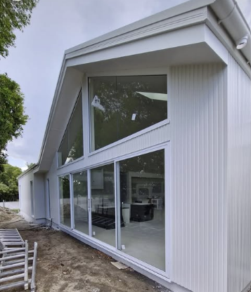 White House With Large Glass Windows, and Angled Roof Side — Architectural Glass Solutions QLD in Cooroy, QLD