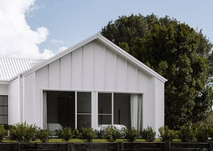 White House With Large Windows and a Gabled Roof, and a Wooden Fence — Architectural Glass Solutions QLD in Cooroy, QLD
