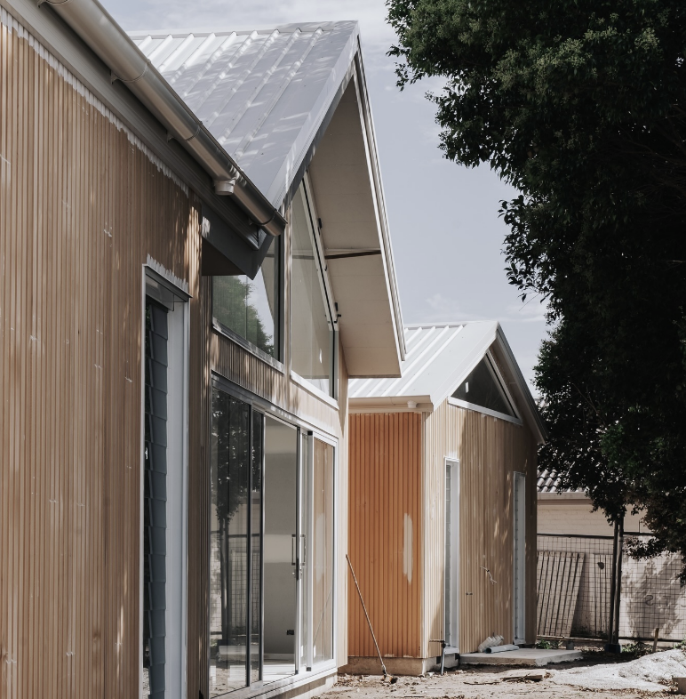 Modern Buildings With Light Wood Siding, Gabled Roofs, and Glass Windows — Architectural Glass Solutions QLD in Cooroy, QLD