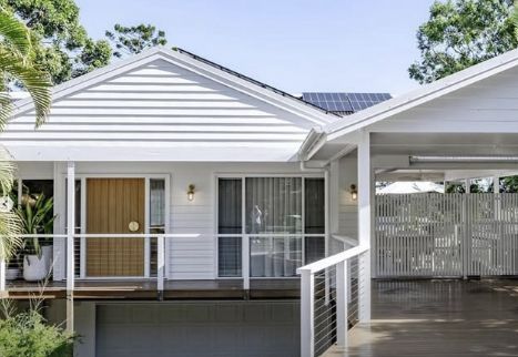 White House With a Brown Door and a Covered Car Port — Architectural Glass Solutions QLD in Cooroy, QLD