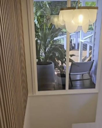 Window View of a Deck With a Chair and Potted Plant — Architectural Glass Solutions QLD in Cooroy, QLD