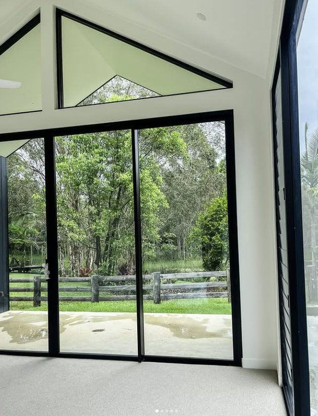 Interior of a Room With Black-framed Windows, White Walls and Ceiling — Architectural Glass Solutions QLD in Cooroy, QLD