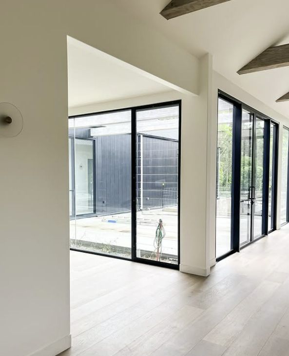 Interior View of a Building With Large Glass Windows and Black Frames — Architectural Glass Solutions QLD in Cooroy, QLD