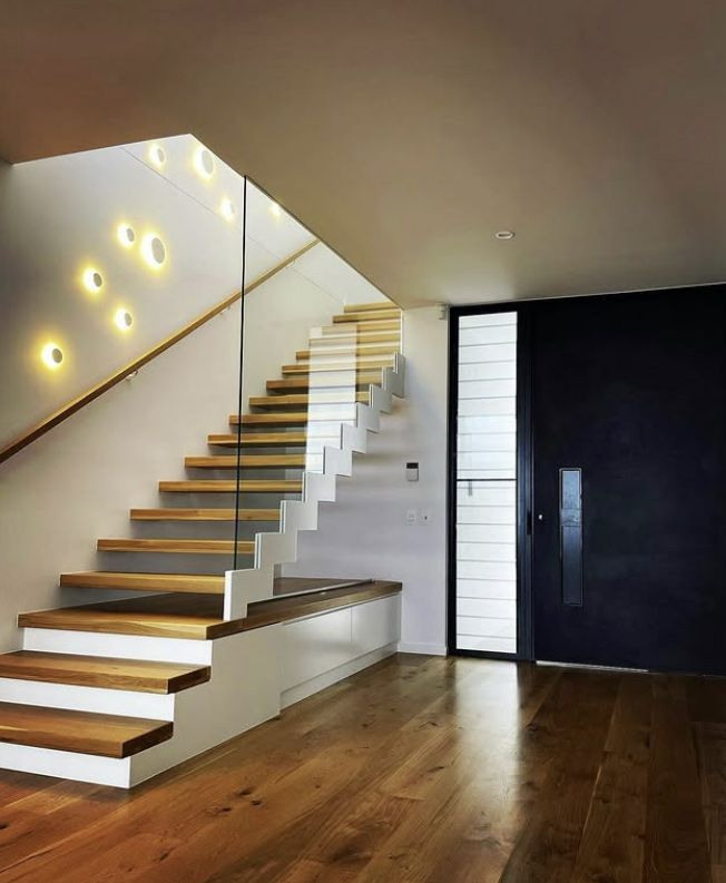 A Wooden Staircase, White Walls &  Lights, Glass Railing & Entry Door — Architectural Glass Solutions QLD in Cooroy, QLD