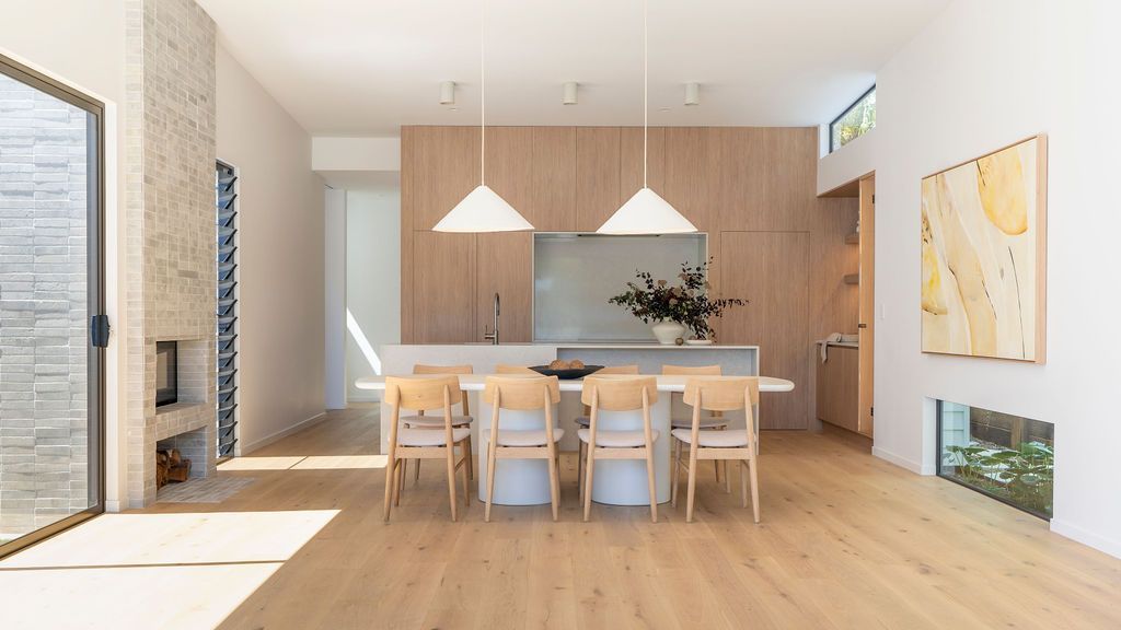 Dining room with light wood floors, a white table with chairs — Architectural Glass Solutions QLD in Cooroy, QLD