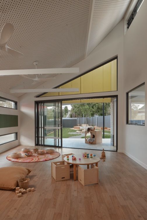 Childcare Room With Open Sliding Doors to a Green Yard — Architectural Glass Solutions QLD in Cooroy, QLD