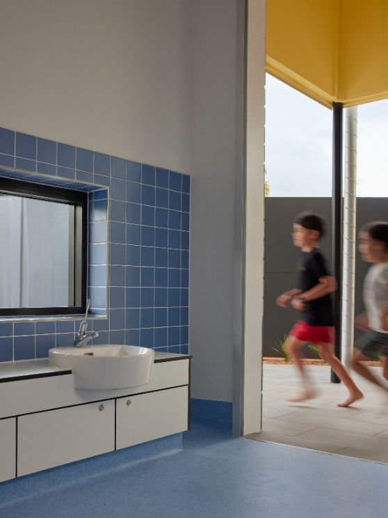 A Bathroom With Blue Tiles and a Sink — Architectural Glass Solutions QLD in Cooroy, QLD
