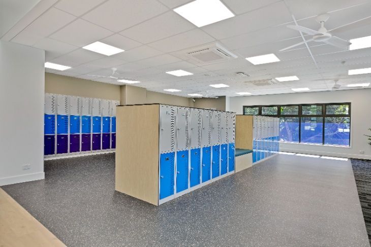 A Large Room Filled With Lots of Blue and Purple Lockers — Architectural Glass Solutions QLD in Cooroy, QLD