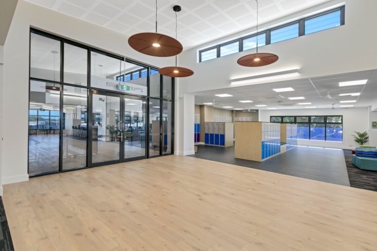 A Large Room With a Lot of Windows and a Wooden Floor — Architectural Glass Solutions QLD in Cooroy, QLD