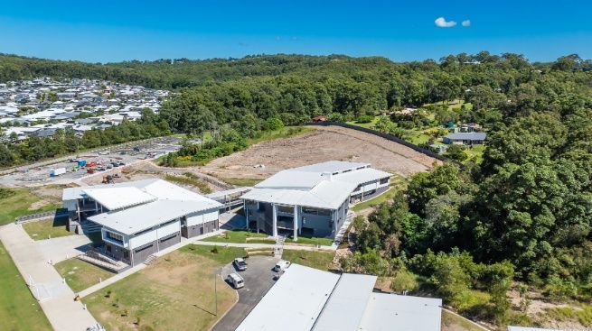 A Large Building Surrounded by Trees — Architectural Glass Solutions QLD in Cooroy, QLD
