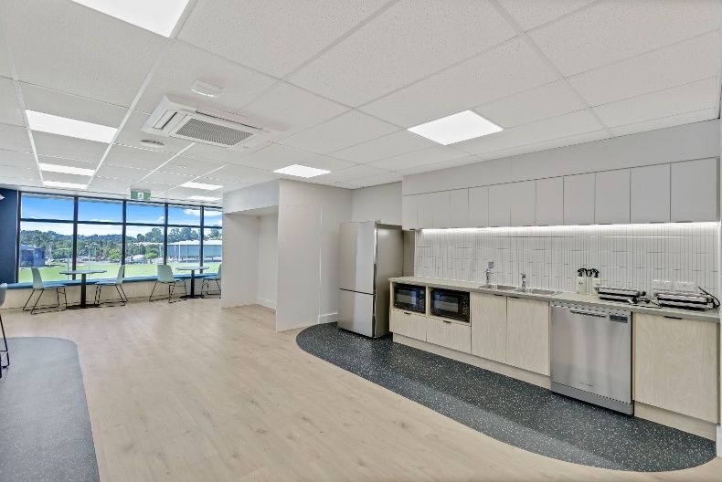 A Kitchen With White Cabinets , Stainless Steel Appliances — Architectural Glass Solutions QLD in Cooroy, QLD