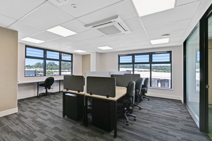 A Large Office With a Lot of Desks and Chairs — Architectural Glass Solutions QLD in Cooroy, QLD