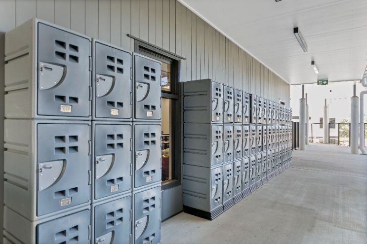 A Row of Lockers Are Lined Up in a Hallway — Architectural Glass Solutions QLD in Cooroy, QLD