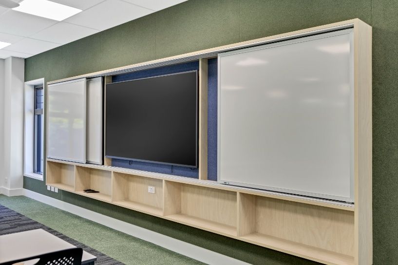 A Classroom With a Large Flat Screen Tv and Whiteboards — Architectural Glass Solutions QLD in Cooroy, QLD