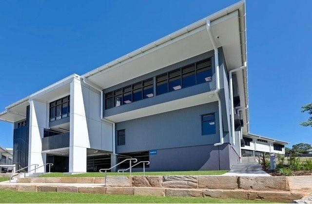 A Large Building With Stairs Leading Up to It  — Architectural Glass Solutions QLD in Cooroy, QLD