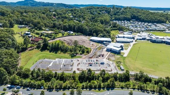 An Aerial View of a Residential Area Surrounded by Trees and Buildings — Architectural Glass Solutions QLD in Cooroy, QLD
