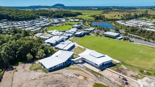 An Aerial View of a Residential Area With Lots of Buildings and Trees — Architectural Glass Solutions QLD in Cooroy, QLD
