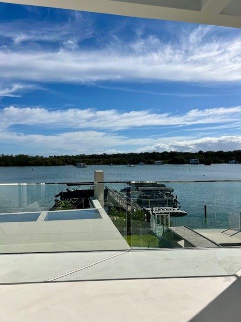 A view of a body of water from a balcony with a glass railing. — Architectural Glass Solutions QLD in Cooroy, QLD