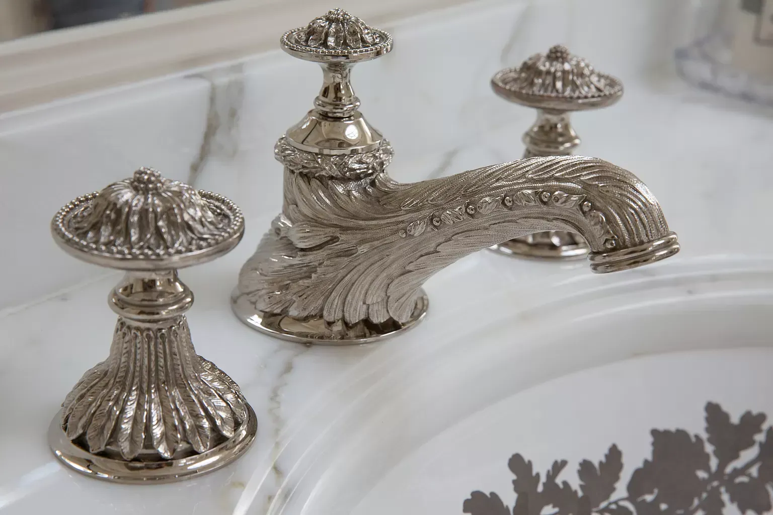 A bathroom sink with a silver faucet on it