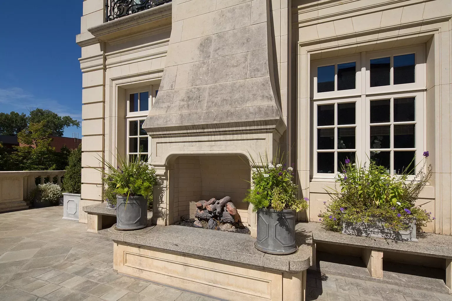 There is a fireplace on the side of a building