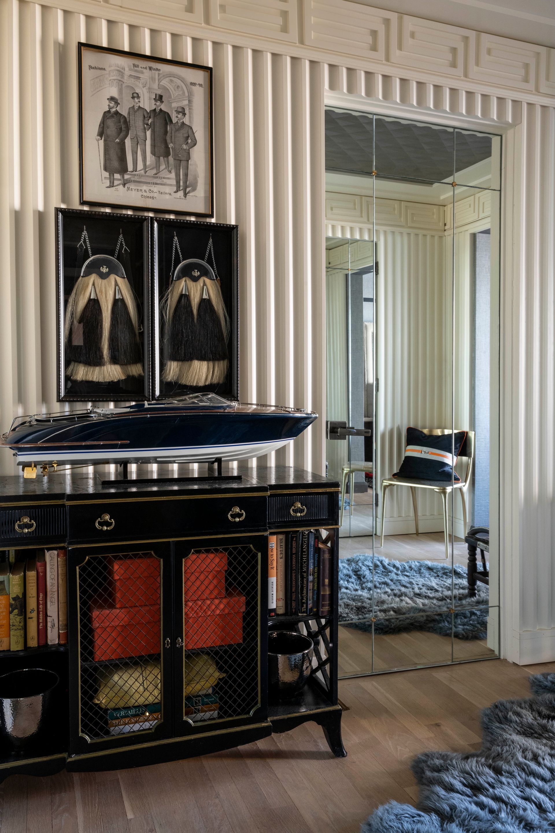 A living room with a dresser and a mirror.