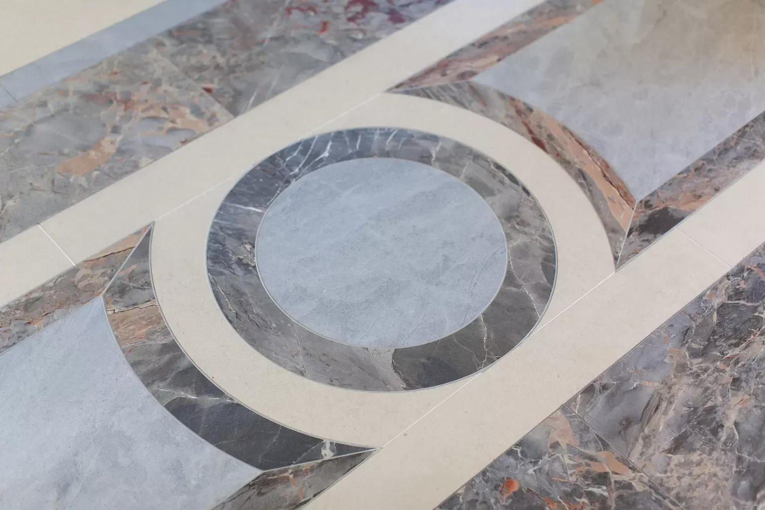 A marble floor with a circle in the middle