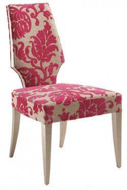 A chair with a pink and white floral pattern on it.