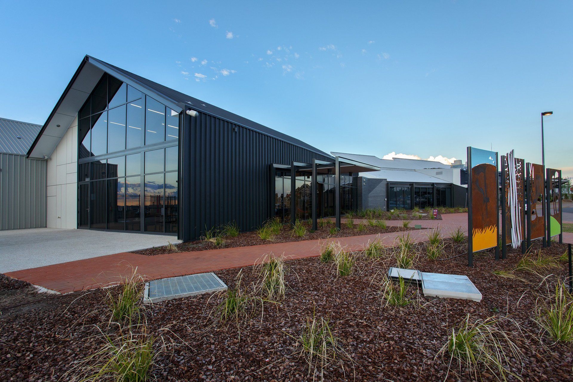 exterior view of armidale airport showing large windows and brick path 