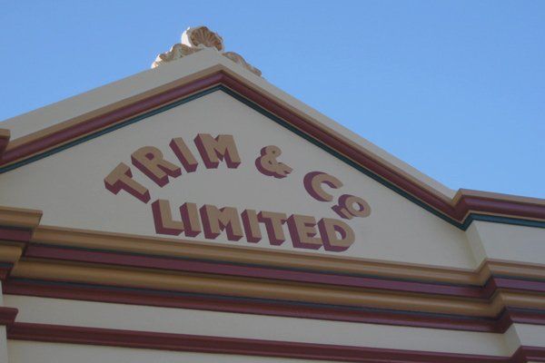close view of painted logo on freeman house armidale