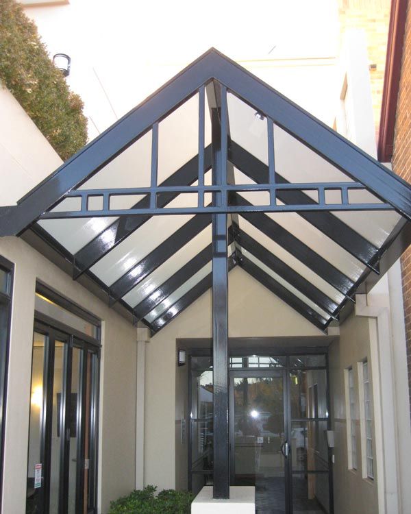 mews on moore building  with a canopy over the entrance