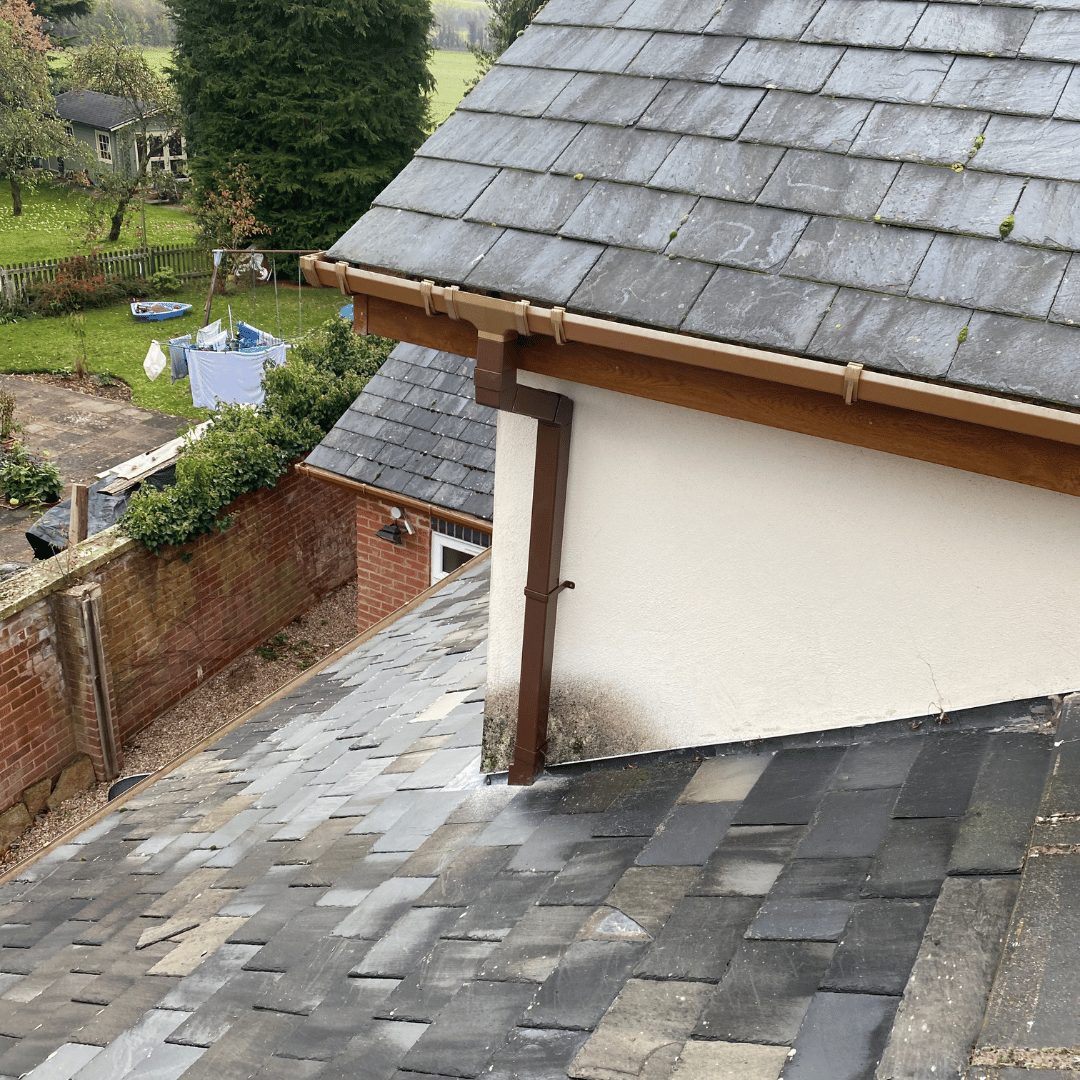 stained natural stone patio beofre cleaning in wariwckshire