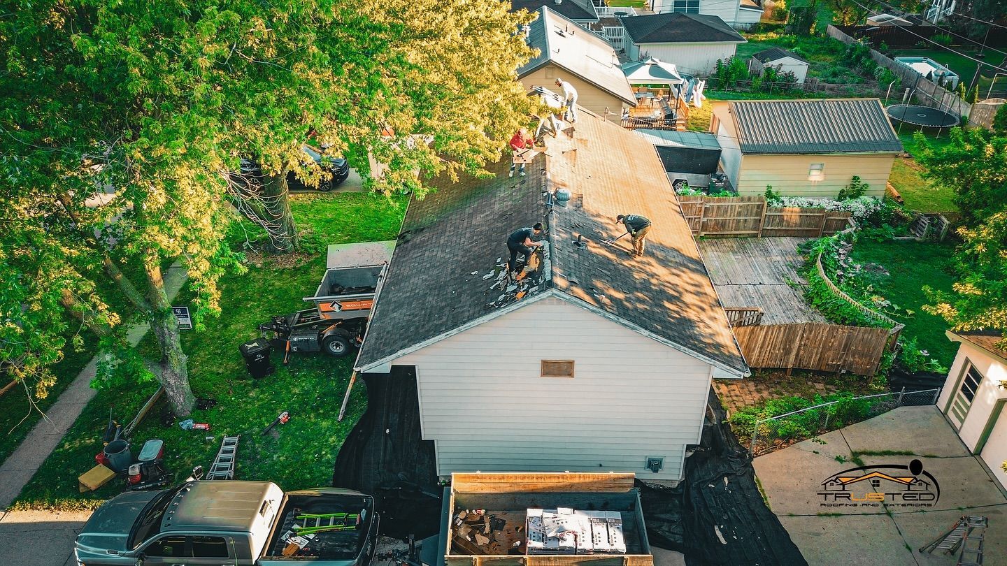 An aerial view of a house undergoing a roof replacement.