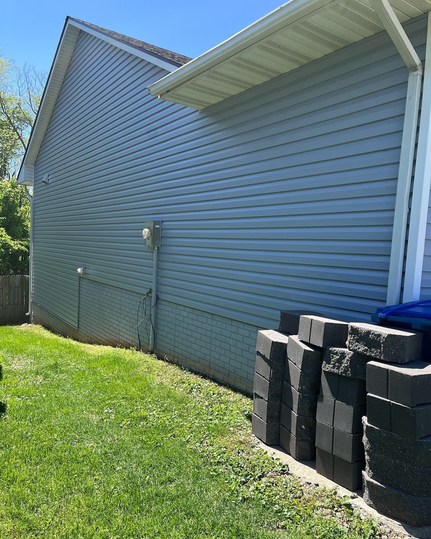 A house with a lot of bricks on the side of it