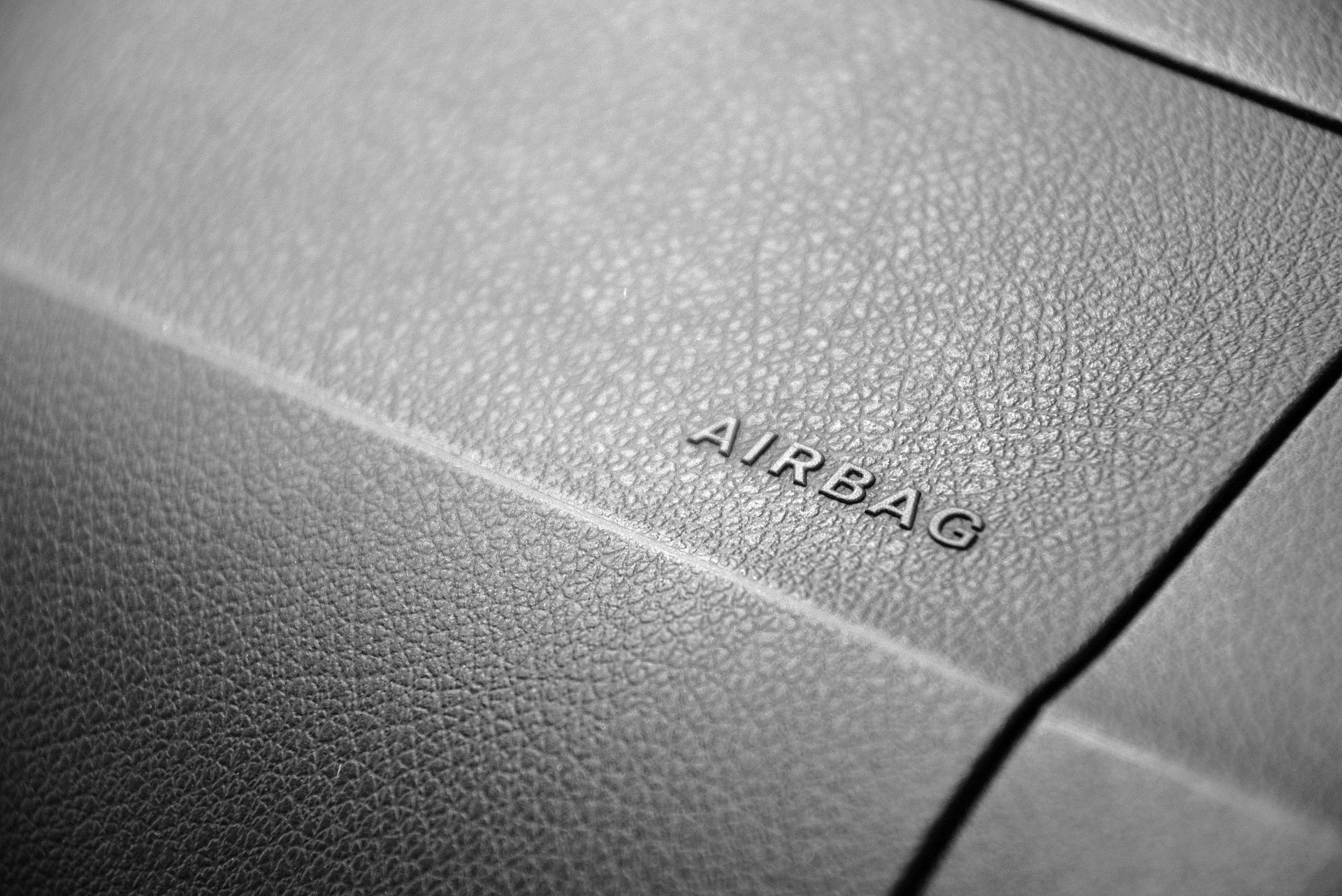 Close-up of a car dashboard, showing the word
