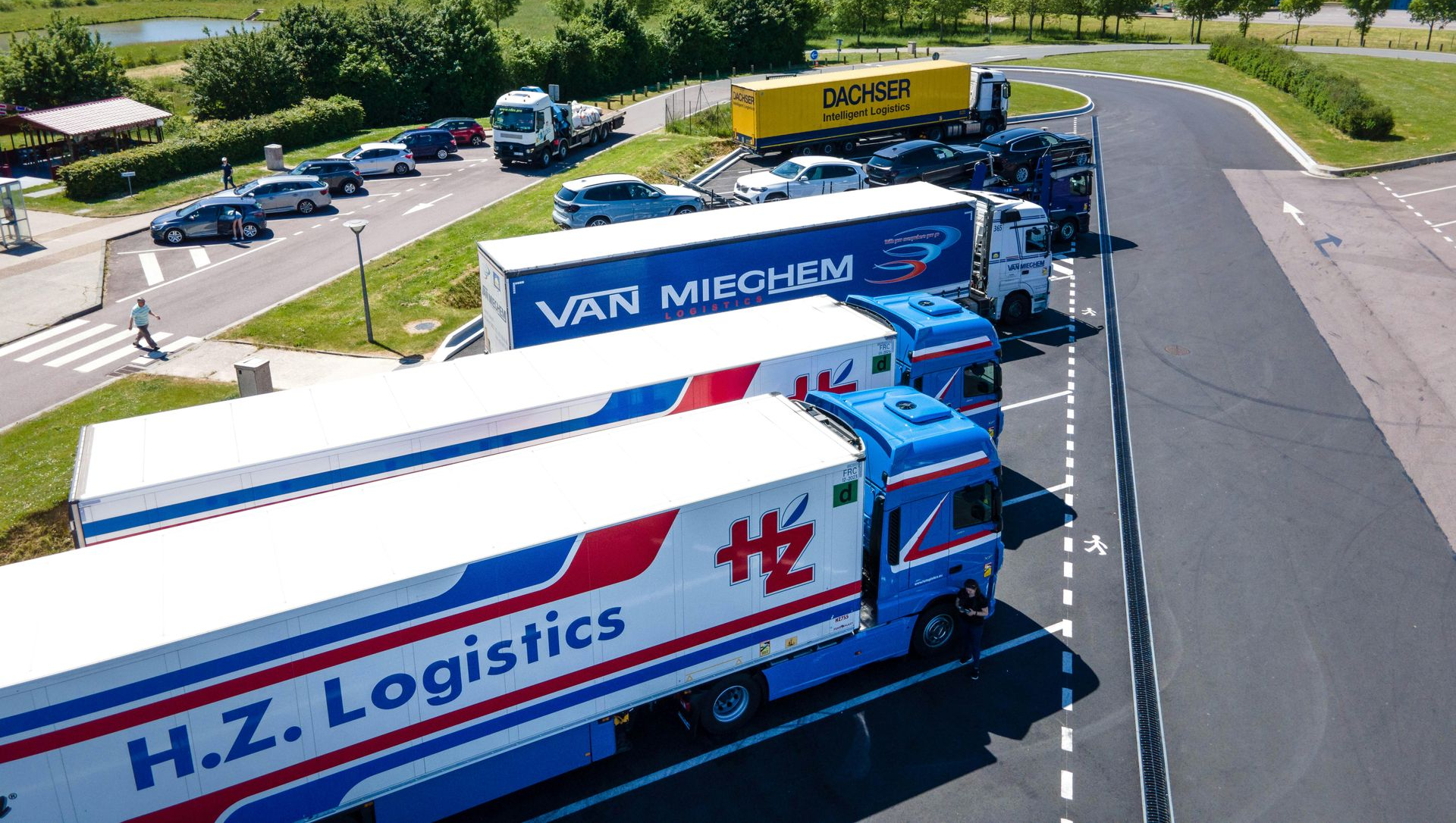 Trucks parked at a rest stop.