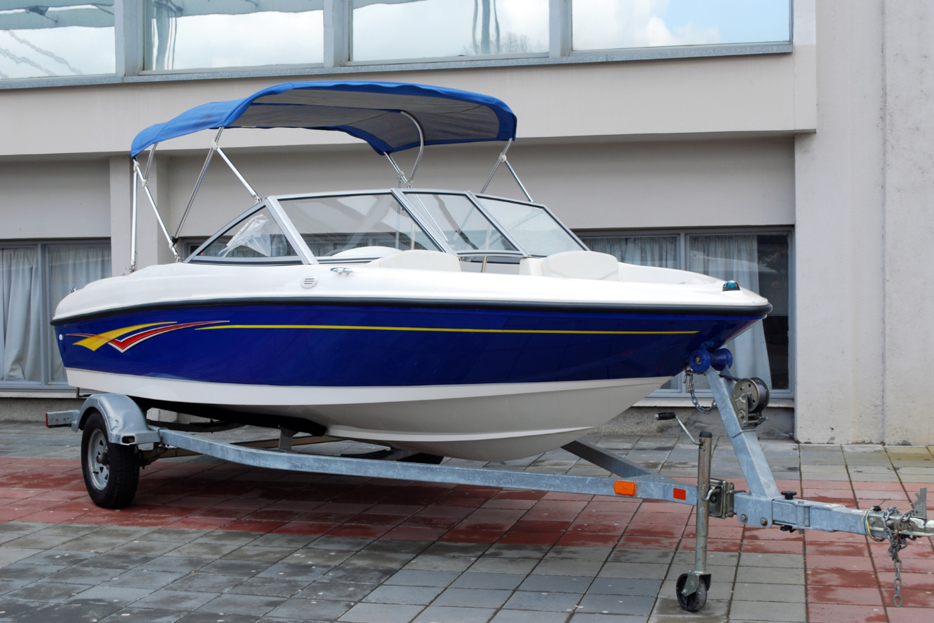 Blue and white speedboat on a trailer