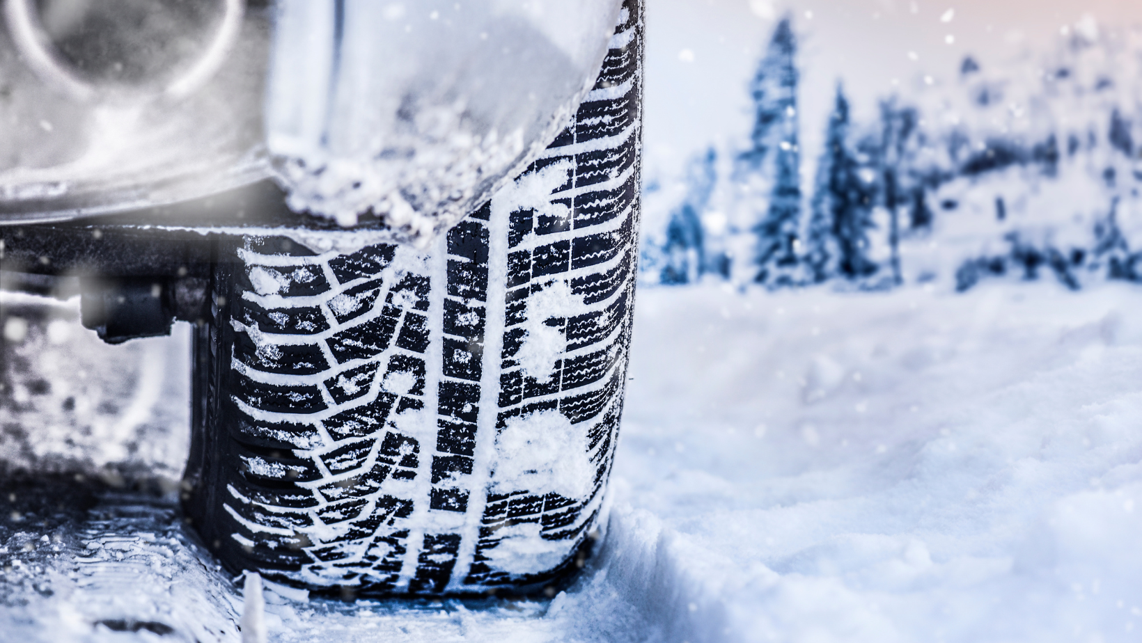 Details of winter tire on a snowy road