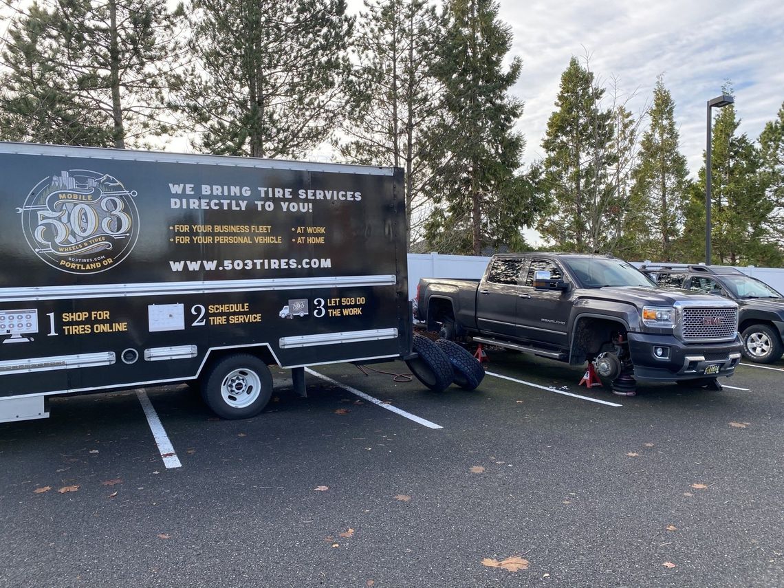 Picture of a pickup truck getting new tires.