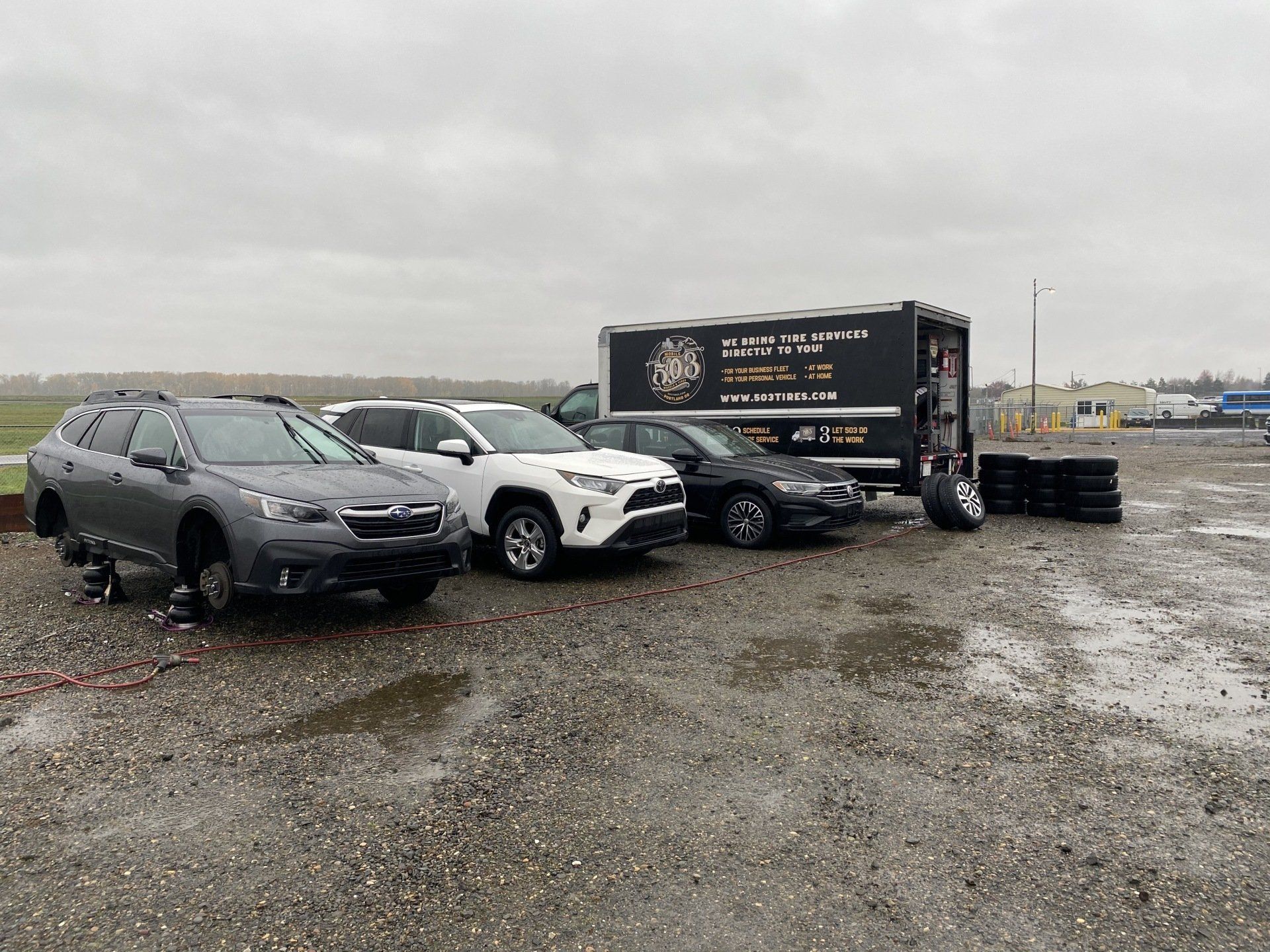 Picture of a three different vehicles and the 503 Truck parked.
