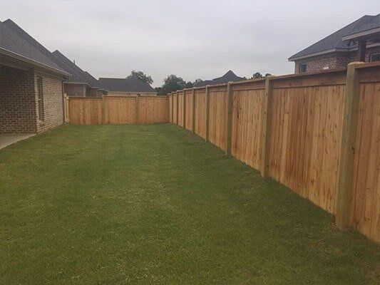 Fence Construction — Residential Home with Fence in Pearl, MS