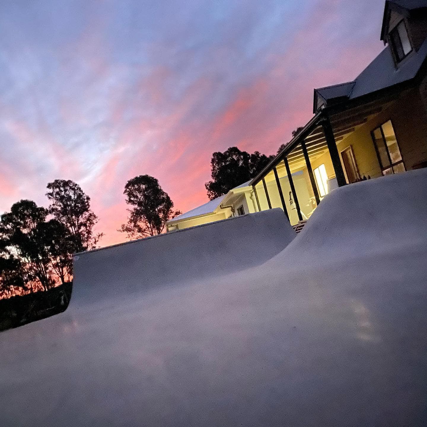 A House With A Ramp In Front Of It At Sunset — Peter Bishop Concreting In Gympie, QLD