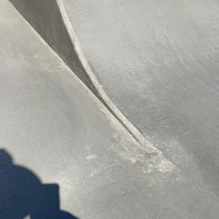 A Close Up of a Concrete Surface With a Shadow on It — Peter Bishop Concreting In Pomona, QLD