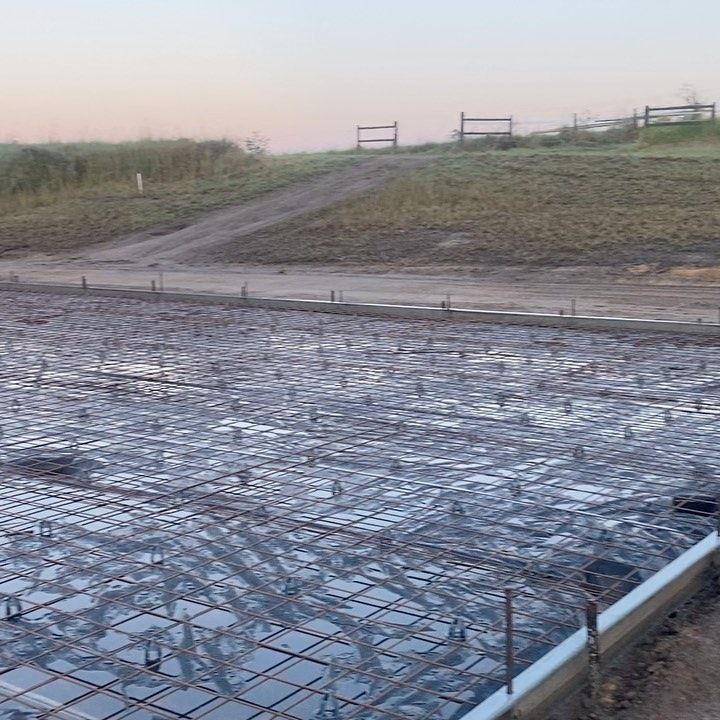 A Concrete Foundation is Being Built in a Field — Peter Bishop Concreting In Kenilworth, QLD