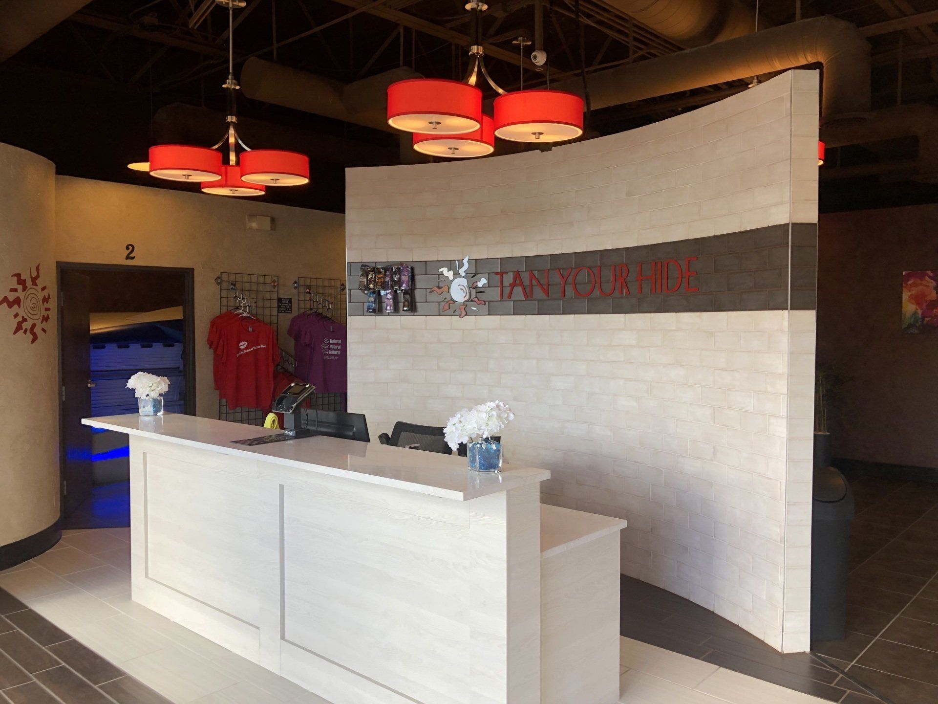 A tanning salon with a large white counter