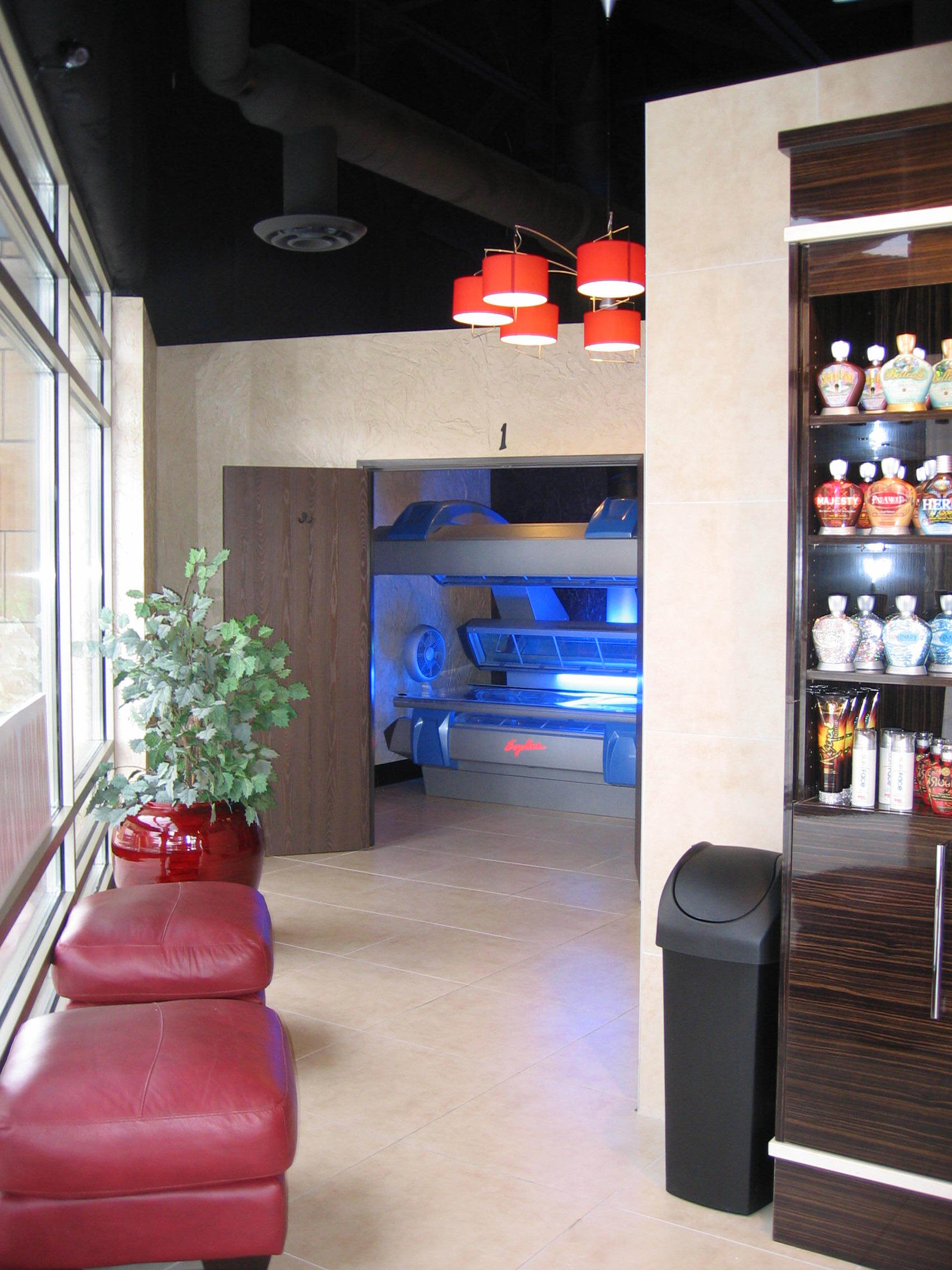 A room with a lot of bottles on shelves