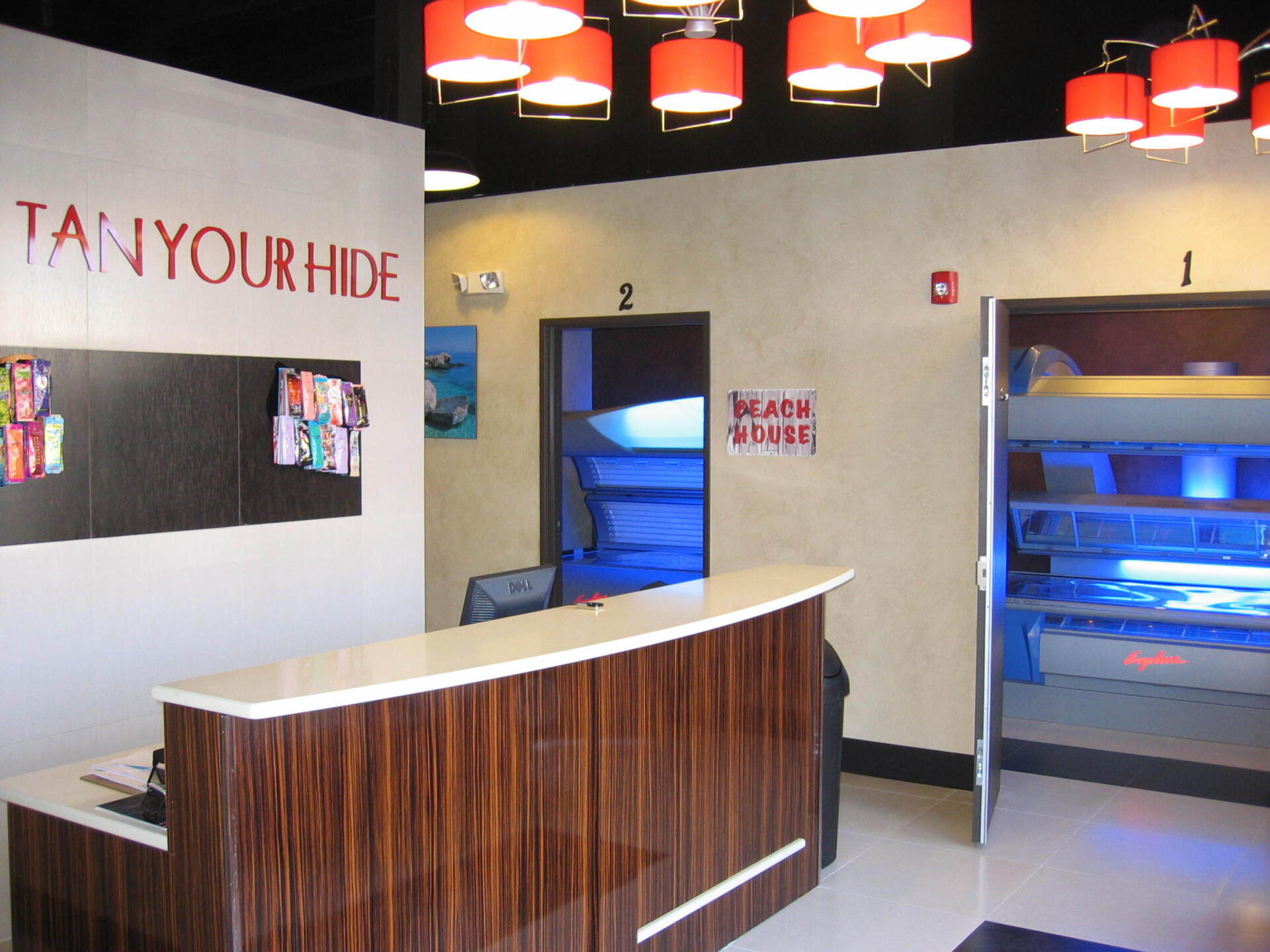 A tan your hide tanning salon with a reception desk